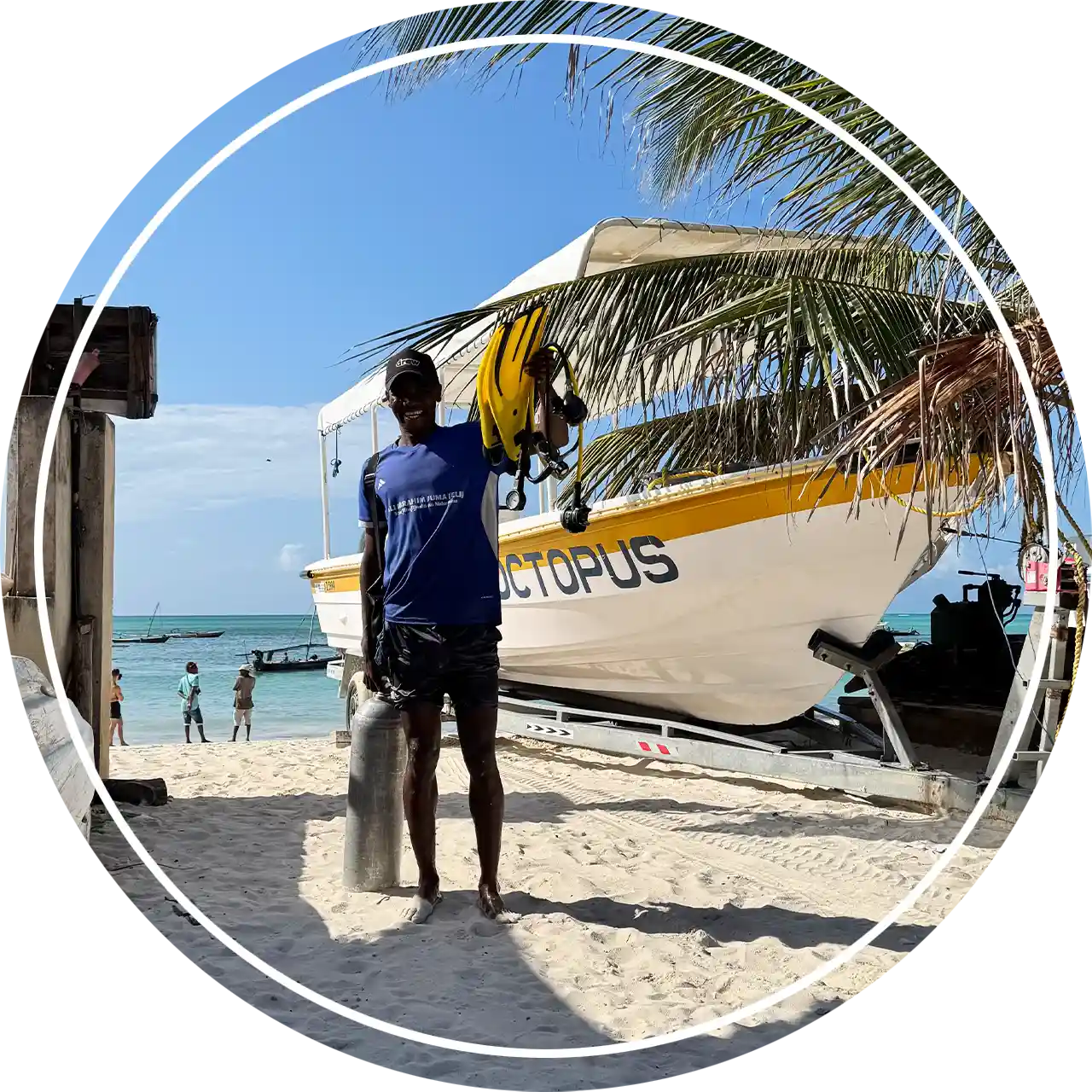 Local boat captain of Fun Divers Zanzibar smiling at the dive center on Nungwi beach.